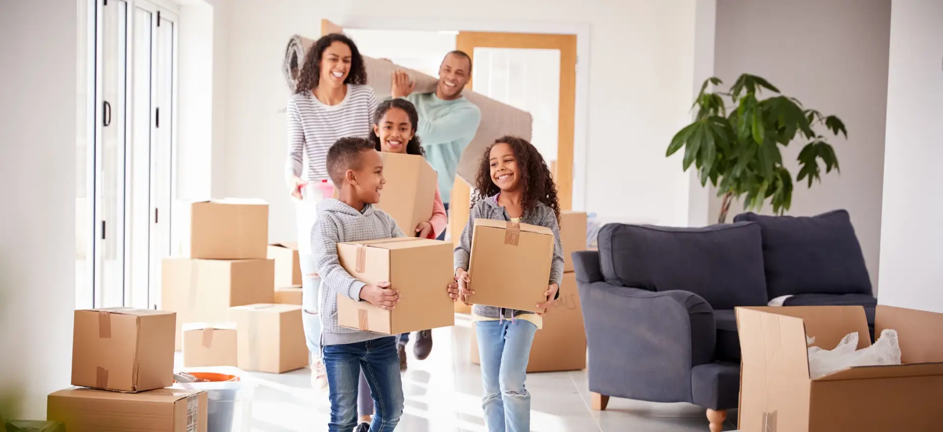 Happy family moving in to their new home thanks to Capital Federal Credit Union